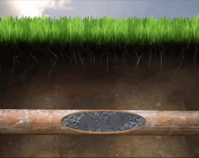 High-pressure hydrojet water stream clearing drain pipe blockages and buildup